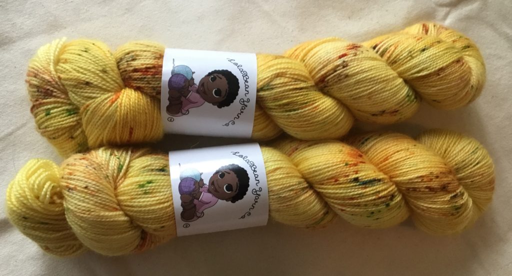 Two skeins of Not so Mellow Yellow Lolabean Navy Bean yarn