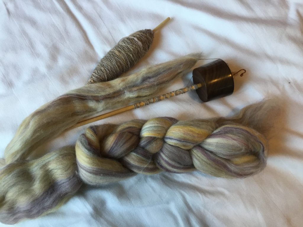 Left to right - cop of single, spindle with new cop started and small braid of top, all of pale rainbow Falkland merino