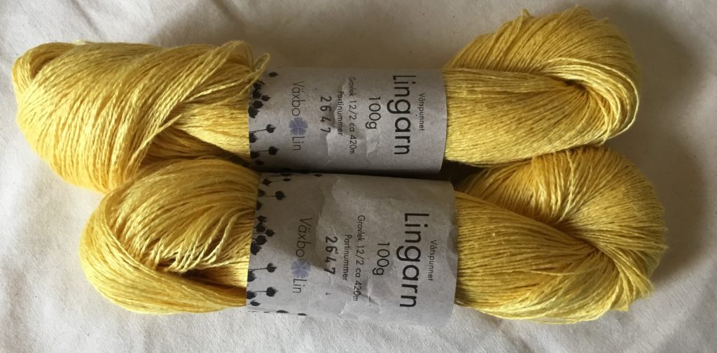 Two skeins of linen yarn in yellow