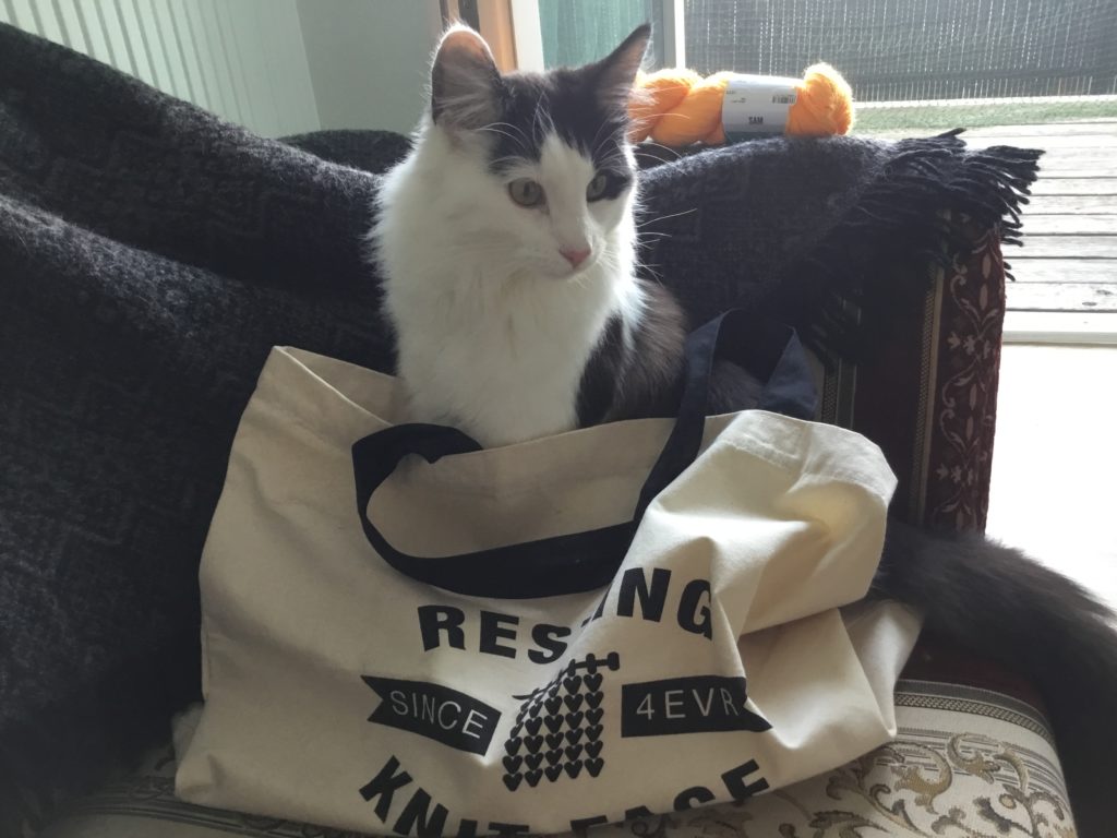 Black and white cat in Resting Knit Face tote bag