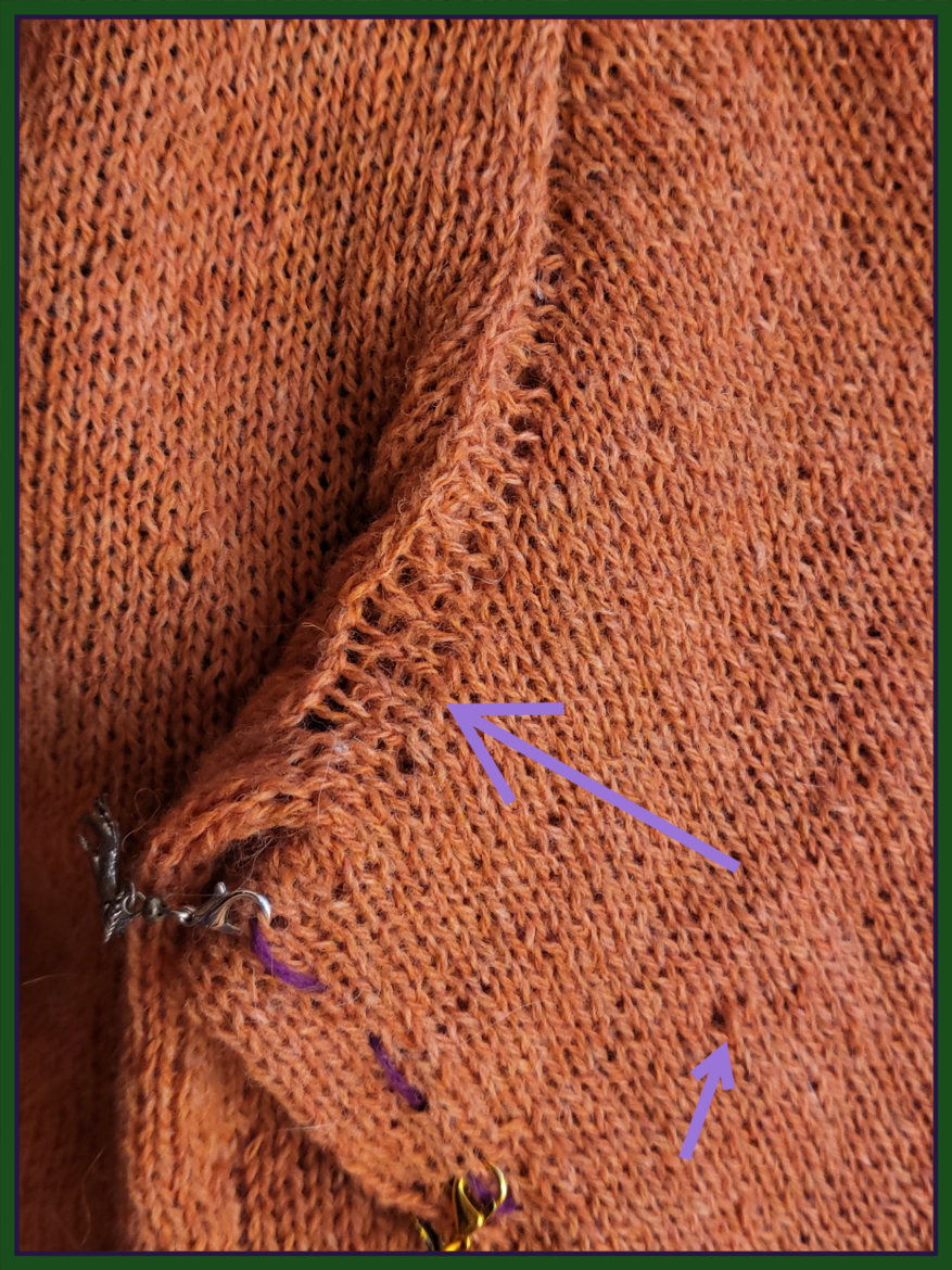 Close up of knitting in orange wool with purple arrows indicating areas of especially uneven knitting.